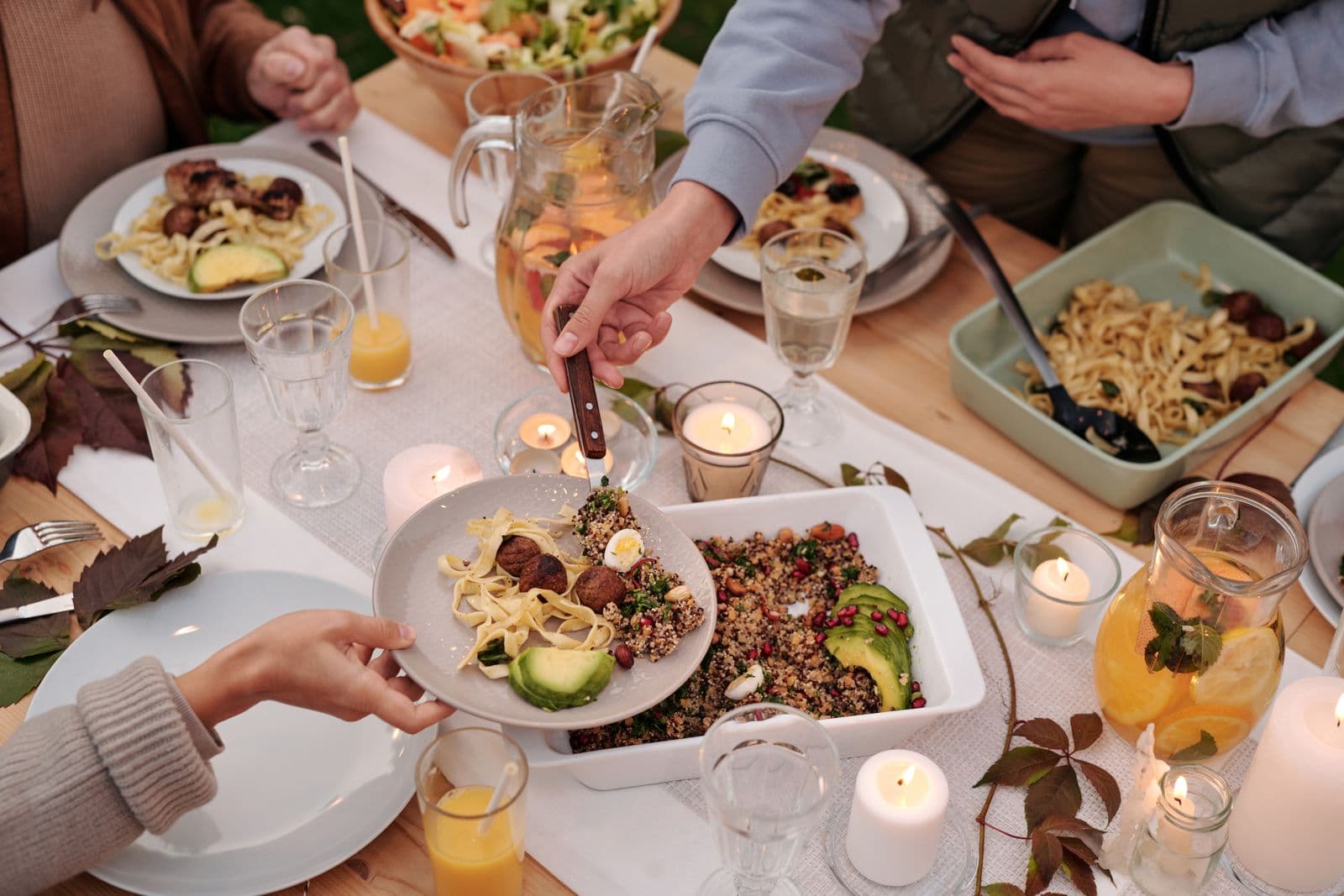 People sharing food and conversation around a table